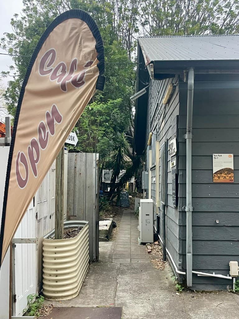 Cafe Open flag beside AMA Cafe on the Addison Road Community Centre grounds