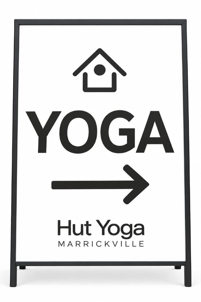Hut Yoga Marrickville A-frame sign with an arrow pointing the way to class